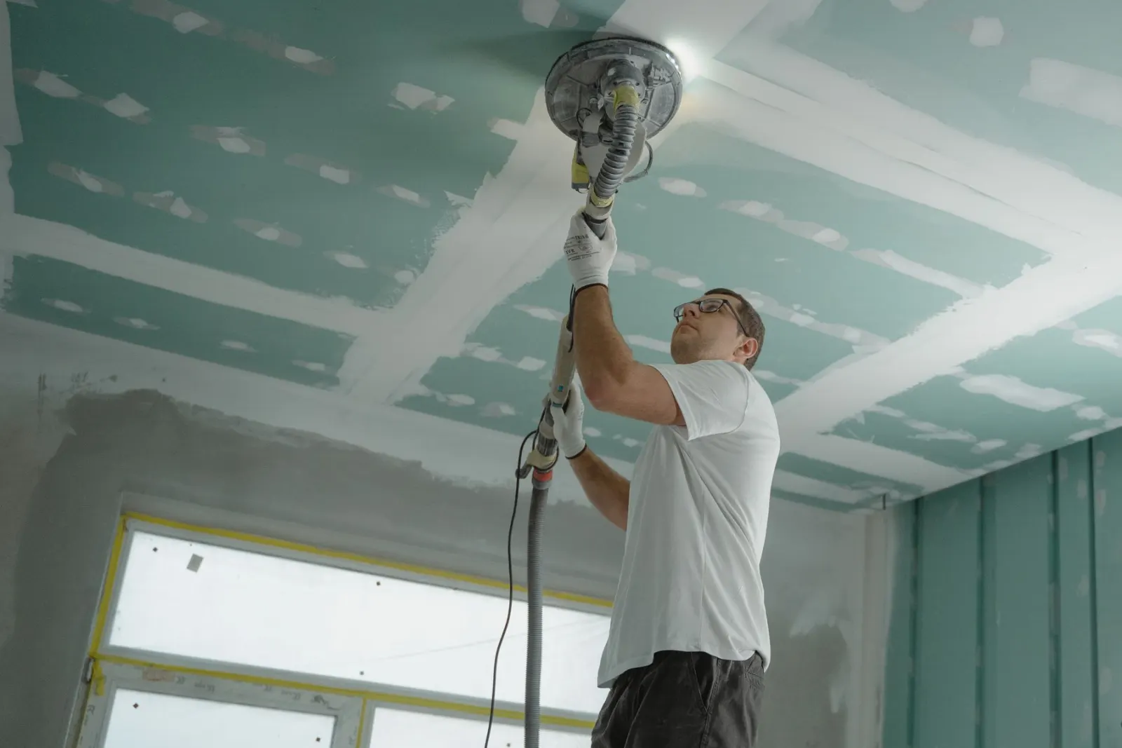 Flattening a ceiling surface overhead