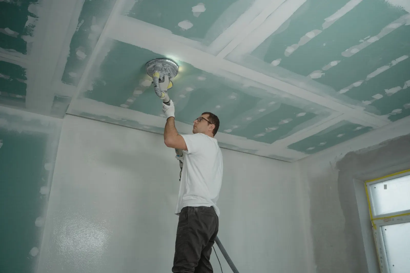 Working overhead to finish a ceiling