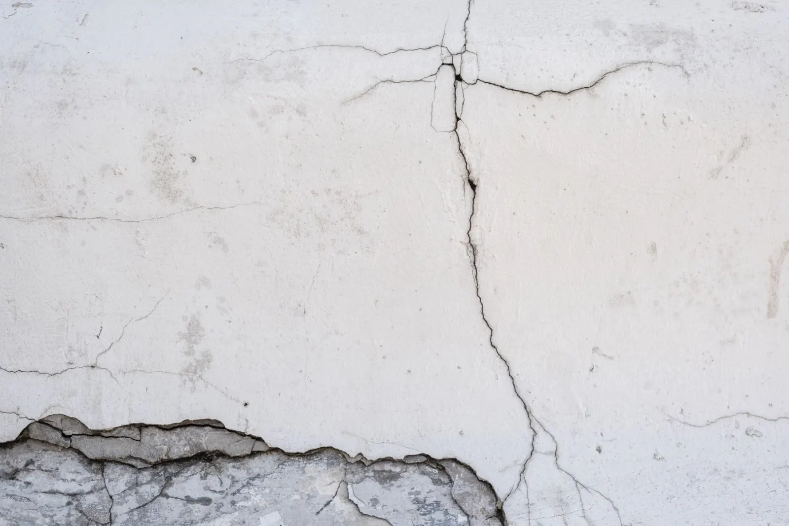 Cracking across a painted wall surface
